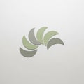 Paper pieces in light green and olive green are arranged in a circular Royalty Free Stock Photo