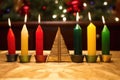 seven different candles in a traditional kwanzaa kinara