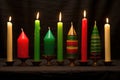 seven different candles in a traditional kwanzaa kinara