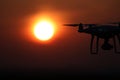 Silhouette of drones in the sky, red sunset Royalty Free Stock Photo