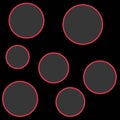Gray spots with red outlines on black background