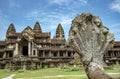 A seven-headed serpent built of sandstone as a railing leads up to Angkor Wat on the east side of the castle in Siem Reap