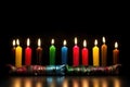 the seven kwanzaa candles glowing against dark backdrop Royalty Free Stock Photo