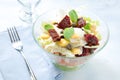 Seven-layer salad with egg, tuna, dried tomatoes