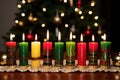 seven lit front view kwanzaa candles Royalty Free Stock Photo