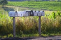 Seven mail boxes on a country road