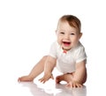 Seven month Infant child baby toddler sitting and happy looking laughing at the corner with text space isolated on a white Royalty Free Stock Photo