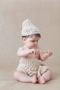Baby girl playing with a wooden honey spoon Royalty Free Stock Photo