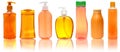 Seven orange Plastic Bottles With Shampoo, Liquid Soap, Shower Gel. Isolated on white background with reflection. Royalty Free Stock Photo