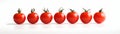 Seven red cherry tomatoes on a white background. Similarities and differences. Web banner Royalty Free Stock Photo