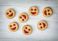 Seven round biscuits smiling faces, humorous food