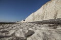 Seven Sisters and Beachy Head cliffs, England - chalk rocks on the beach. Royalty Free Stock Photo