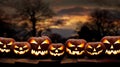 Seven spooky halloween pumpkin, Jack O Lantern, with an evil face and eyes on a wooden bench