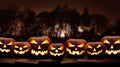 Seven spooky halloween pumpkin, Jack O Lantern, with an evil face and eyes on a wooden bench