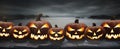 Seven spooky halloween pumpkins, Jack O Lantern, with an evil face and eyes Royalty Free Stock Photo