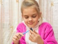 Seven-year girl on stack makes drawing Crafts from clay