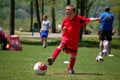 Young Boy Playing Soccer in Youth League