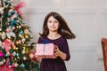 Seven-year-old girl with a gift for the new year Royalty Free Stock Photo