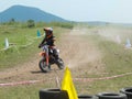 Youngest motocross rider cornering in motocross race.