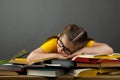 Seven years old child reading a book at home. Boy studying at table Royalty Free Stock Photo