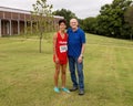 Seventy-three year-old Caucasian grandfather with his fourteen year-old Amerasian grandson after a cross country race in Oklahoma.