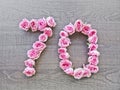 70, seventy - vintage number of pink roses on the background of dark wood5