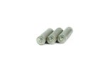 Several AA batteries in perspective closeup view on white background Royalty Free Stock Photo