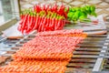 Several Adana Kebab skewers lined up