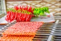 Several Adana Kebab skewers lined up