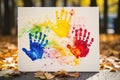 several adult handprints on a family canvas