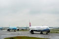 Several aircraft down the runway goes in line for departure Amsterdam Schiphol Airport