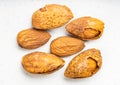 Several almond seeds and drupes close up on gray Royalty Free Stock Photo