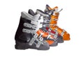 Several alpine ski boots on a light background
