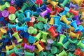 several assorted colors of plastic push pins