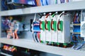 Several batch switches in an electrical control cabinet on a production line surrounded by inverters and control wiring