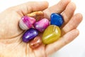 Several Beautiful and Colorful Crystal Stones in hands Royalty Free Stock Photo
