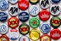 Several beer bottle caps on a white background. Corona, Stella, Budweiser, DosEquis, Molson Royalty Free Stock Photo