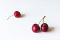 Two cherries in focus and one in the background in blur Royalty Free Stock Photo