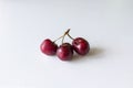 Three sweet cherries on a white background Royalty Free Stock Photo