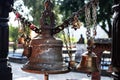 Several big and small bells at a hindu temple in Pokhara, Nepal