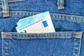 Several bills of twenty euros in the back pocket of jeans. Concept of absentminded person, potential victim of theft. Royalty Free Stock Photo