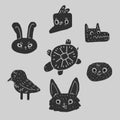 Several black silhouettes of animal heads on a gray background. Hare, fox, jackdaw, owl, turtle, wolf and sparrow