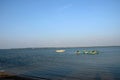 Several blue and yellow boats moored anchored in waters of Jaffna Sri Lanka