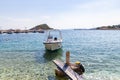 Several boats bobbing in the harbour of Agios Nikolaos, Zakynthos, Greece