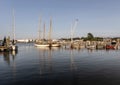 Several boats sitting on a dock in a harbor on marthas vineyard