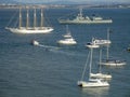 several boats on the Tagus River in Lisbon and Almada in the background