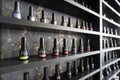 Several bottles of nail polish at a beauty shop on the black shelf Royalty Free Stock Photo