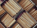 Several boxes filled with matches, a close-up shot. Matchboxes