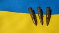 Several bullets are on the Ukrainian flag. Royalty Free Stock Photo