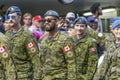 Several Canadian Armed Forces soldiers marching at a public festival parade